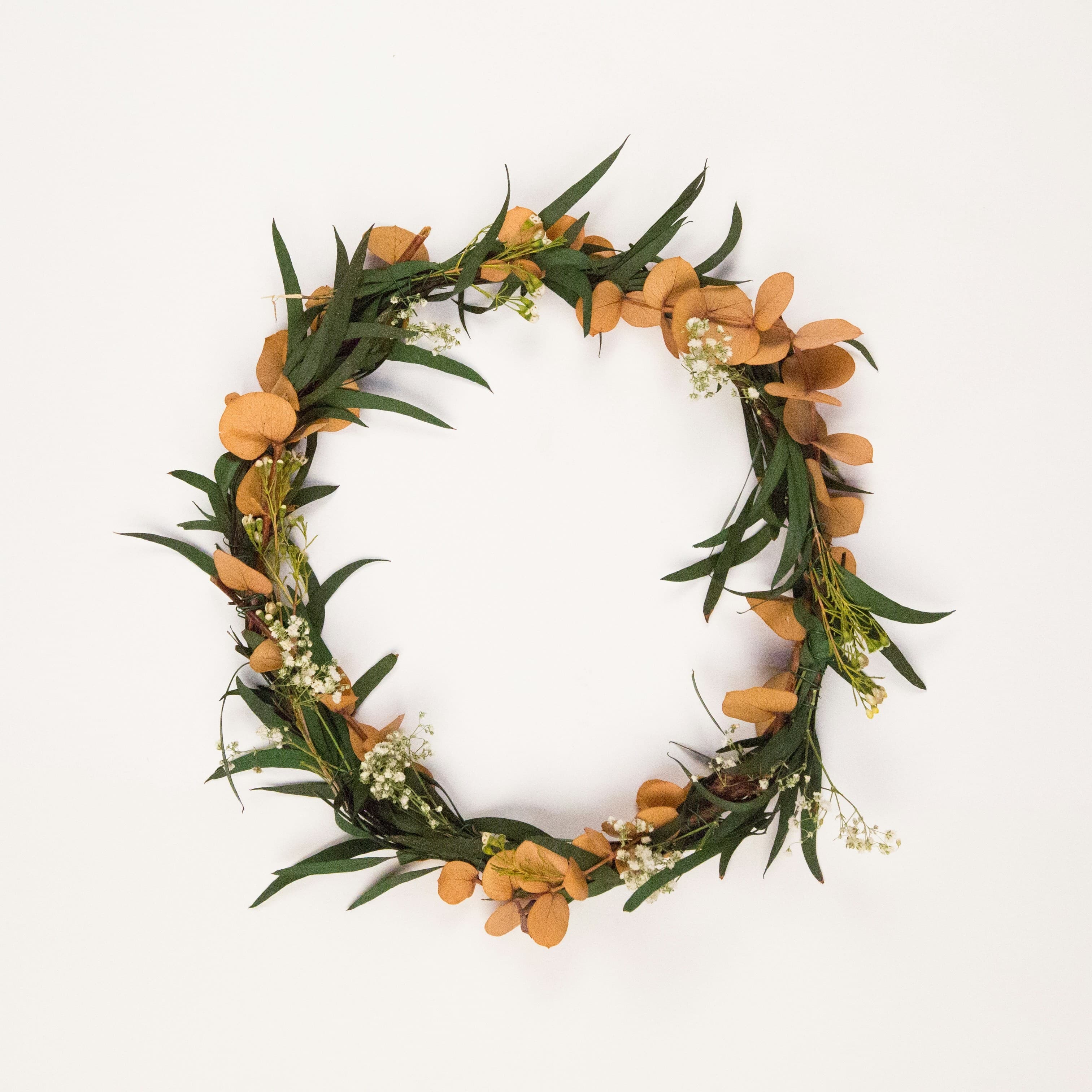 Wildflower wreath photograph beside its cross-stitch pattern